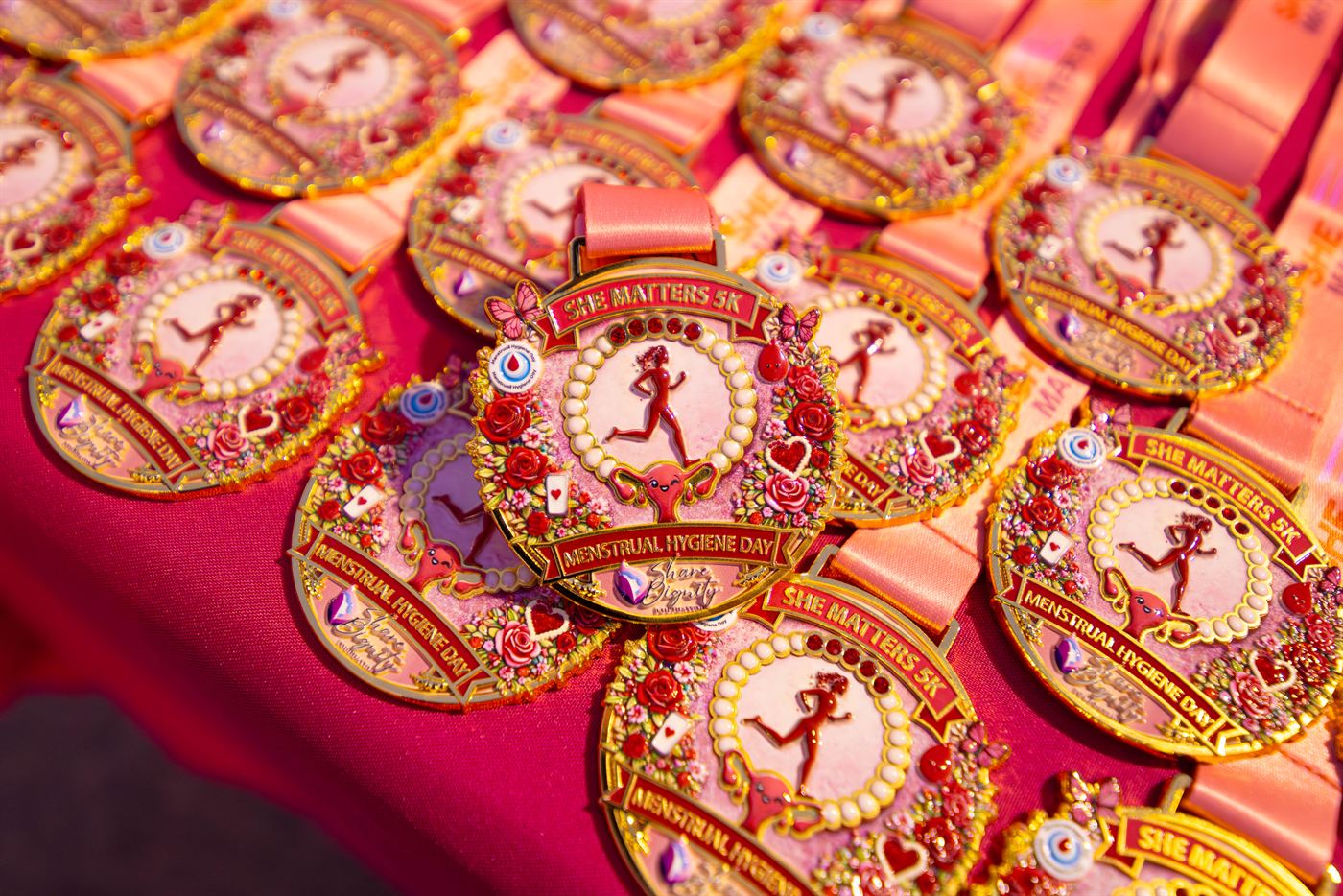 She Matters 5K Event participant with medal